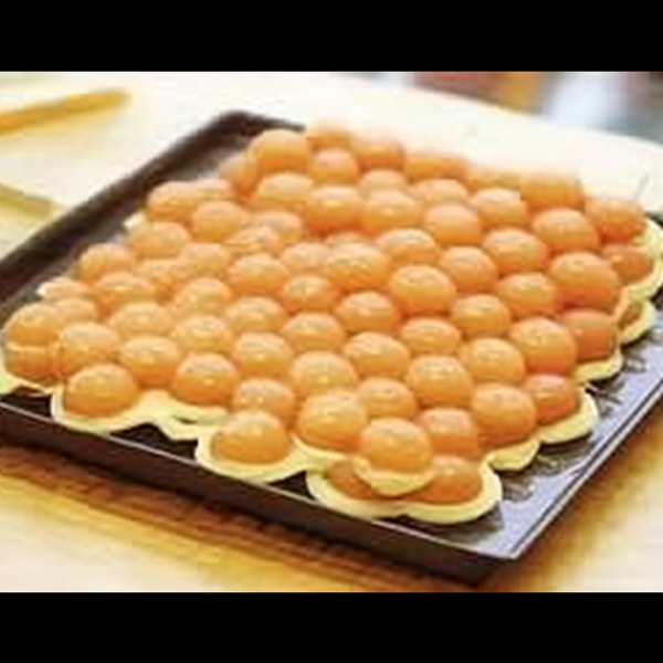 Golden-brown egg waffles, with their unique bubble-like pattern, freshly made at a street stall.